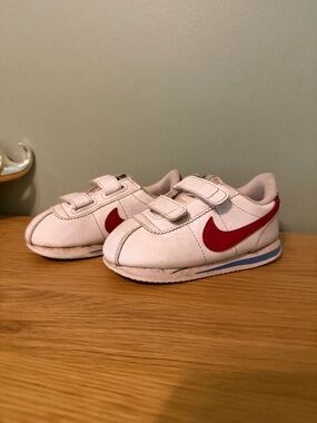 Nike Kids White Sneakers with Red Swoosh